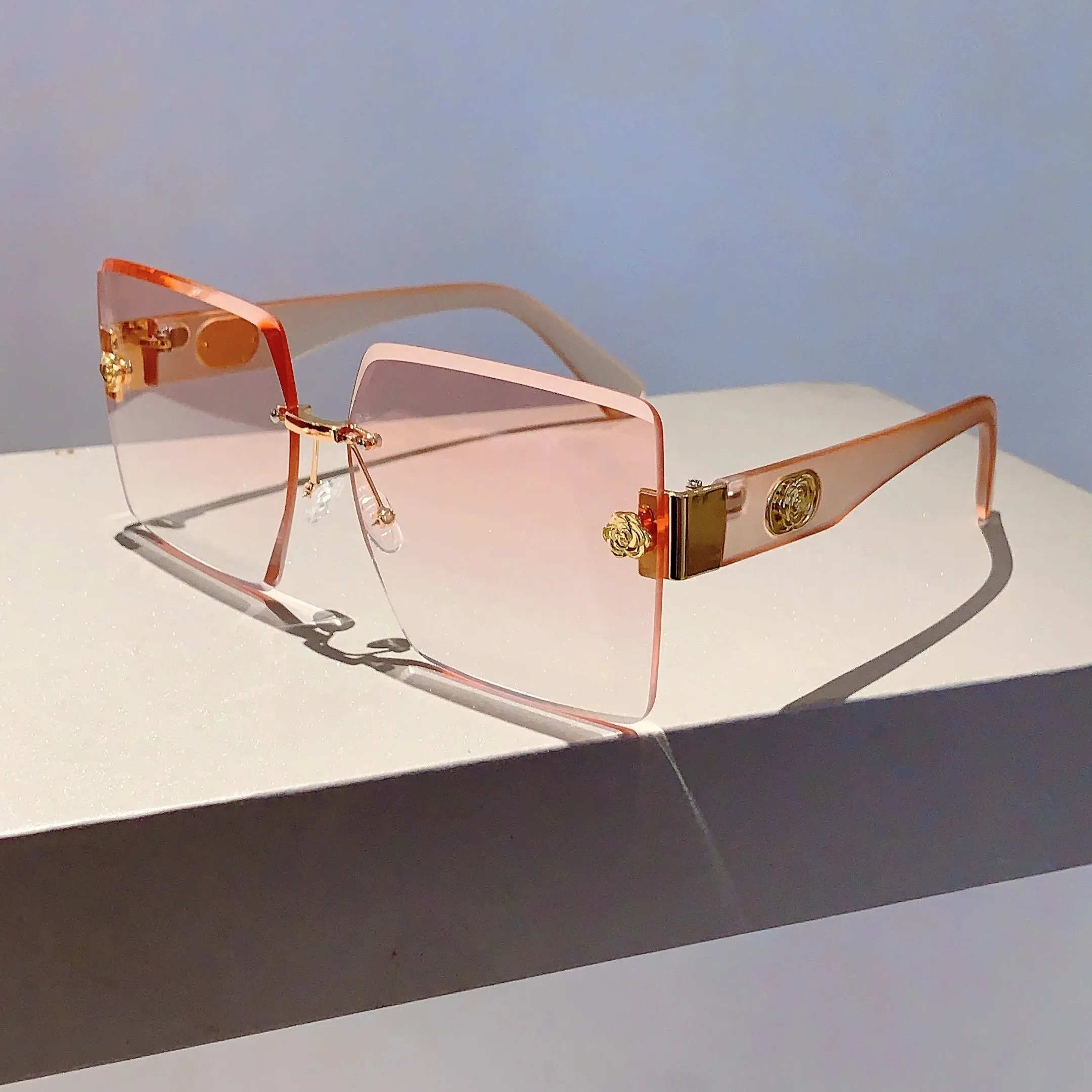 Sunset Glimmer Rimless Sunglasses